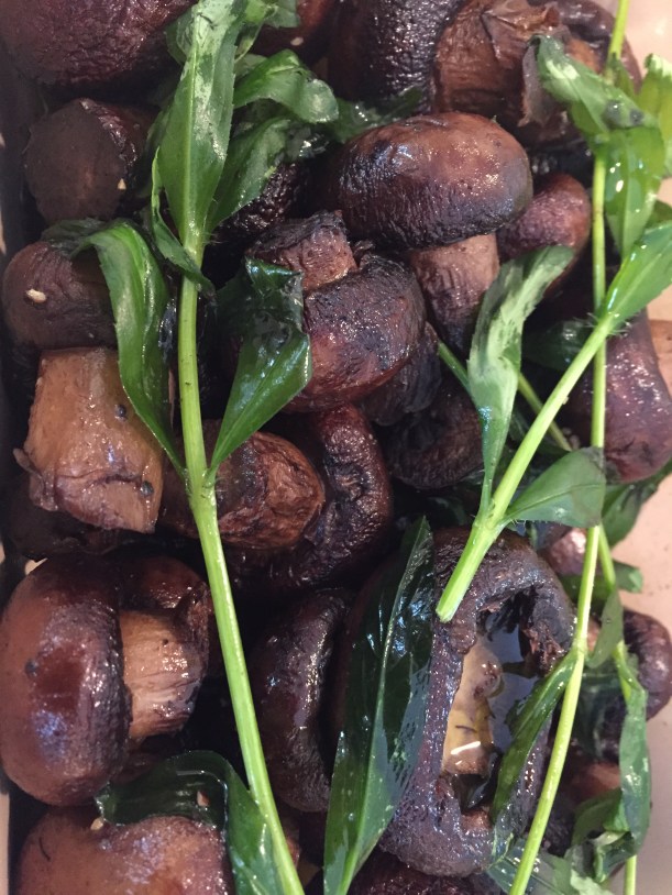 Roasted mushrooms with  olive oil and fresh tarragon.  Serve while warm or at room temperature.