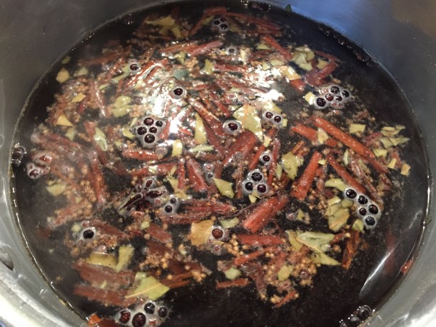 Combine all the spices with water and heat until all are dissolved and the liquid becomes less cloudy.  Pour over ice to cool and then pour the whole thing over the brisket, which is then refrigerated for 10 days.  Cook after that.