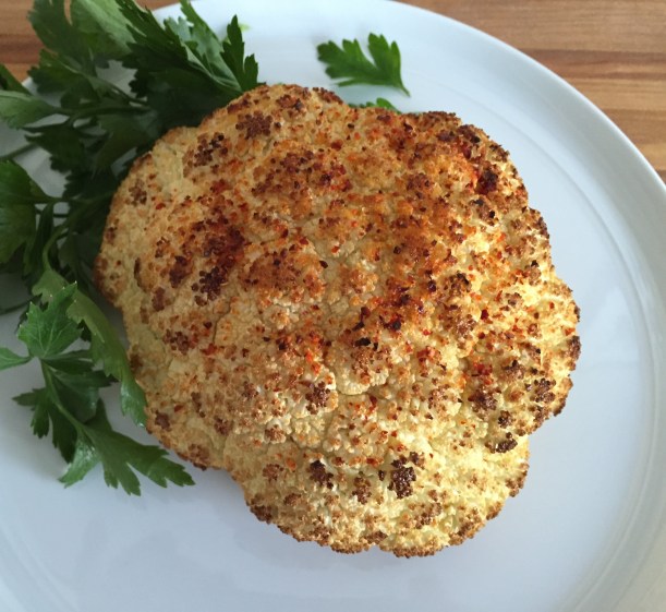 A whole roasted cauliflower is easy and tasty and makes a beautiful presentation as a side dish.