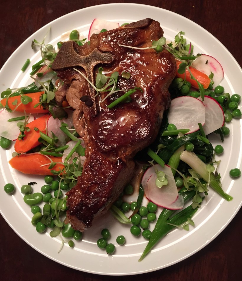 Veal chop, glazed with a veal stock and white wine reduction, served with a variety of simply prepared spring vegetables.