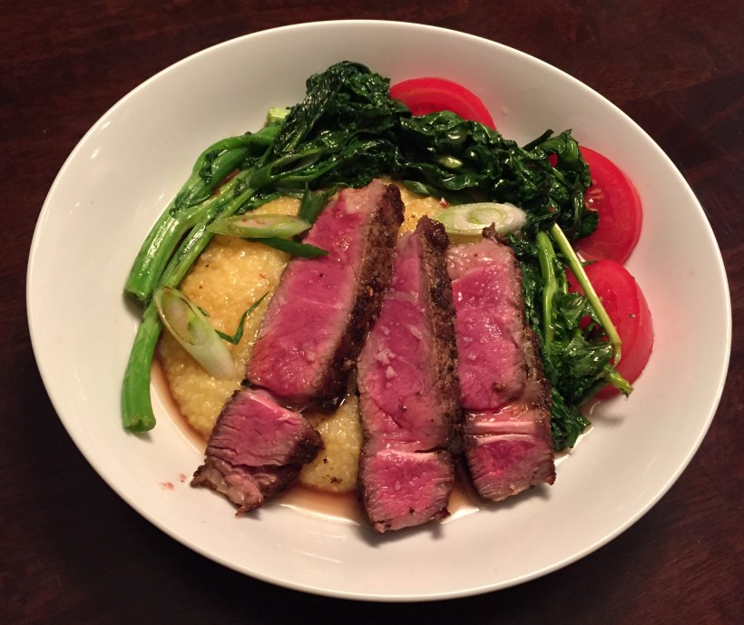 Colorful spring vegetables coupled with rare, sliced ribeye and naturally creamy polenta.