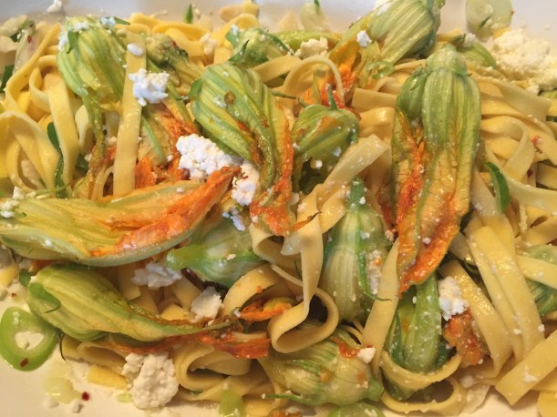 Delicate squash blossoms are tossed in raw at the very end allowing the residual heat from the cooked pasta to lightly wilt them.